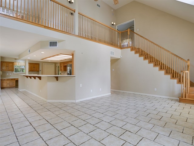 900 Crk 282, Liberty Hill, TX 78642 - unfurnished living room with a high ceiling and stairs