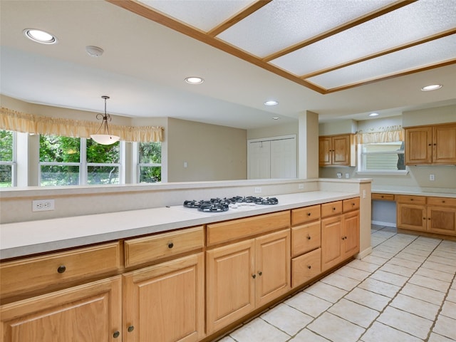 900 Crk 282, Liberty Hill, TX 78642 - kitchen with white gas cooktop, light countertops, recessed lighting, light tile patterned flooring, and decorative light fixtures