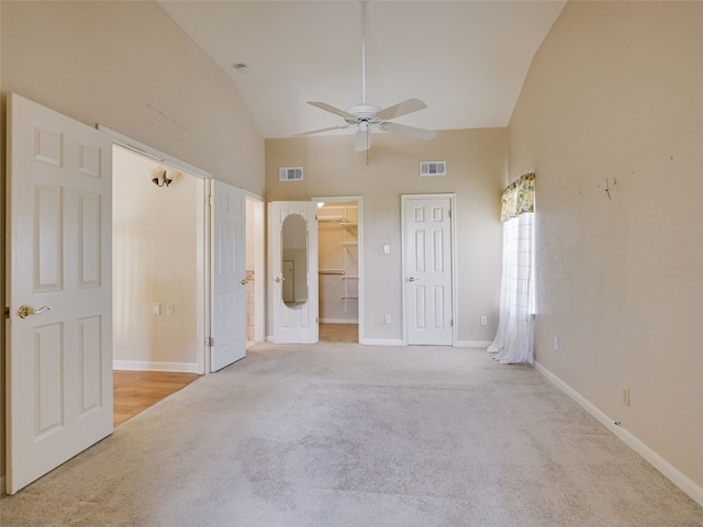 900 Crk 282, Liberty Hill, TX 78642 - unfurnished bedroom with carpet, high vaulted ceiling, a spacious closet, a ceiling fan, and a closet