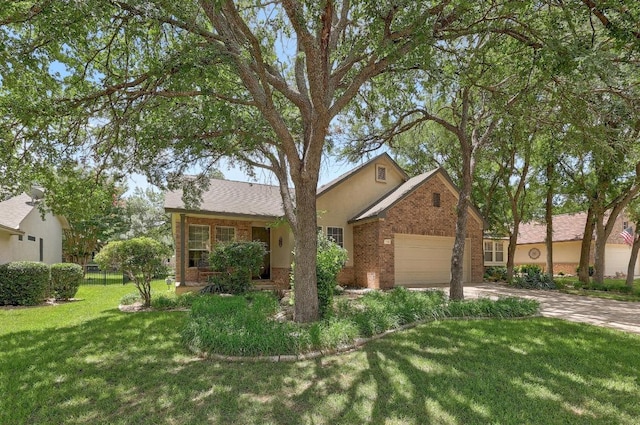 113 Stetson Trl, Georgetown, TX 78633 - view of front of house with brick siding, driveway, and an attached garage