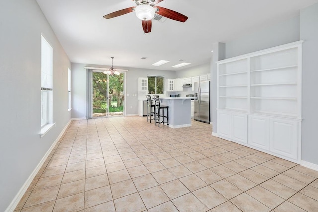 113 Stetson Trl, Georgetown, TX 78633 - living area with a chandelier, a ceiling fan, and light tile patterned floors