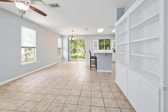113 Stetson Trl, Georgetown, TX 78633 - spare room featuring a chandelier, light tile patterned floors, and a ceiling fan