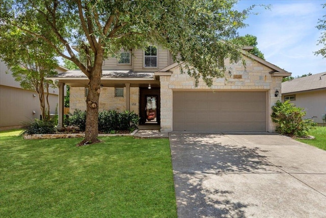 2818 Shadowpoint Cv, Round Rock, TX 78665 - view of front of house with concrete driveway, stone siding, a front lawn, and an attached garage
