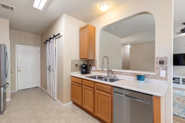2818 Shadowpoint Cv, Round Rock, TX 78665 - kitchen featuring appliances with stainless steel finishes, backsplash, and light countertops