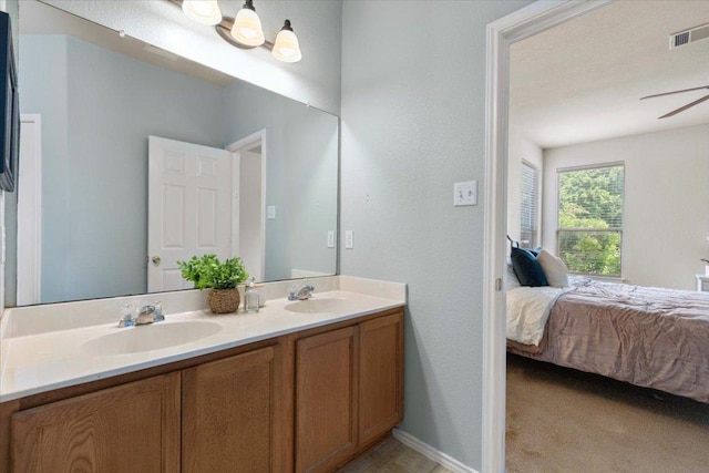 2818 Shadowpoint Cv, Round Rock, TX 78665 - bathroom featuring double vanity, ensuite bathroom, and a ceiling fan