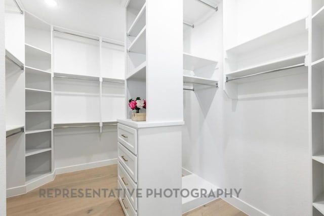 304 Bird Holw, Austin, TX 78737 - walk in closet featuring wood finished floors