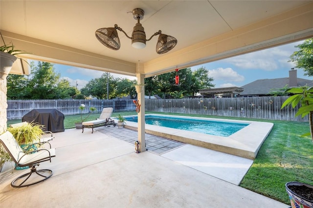 1003 Brayden Cv, Georgetown, TX 78626 - view of swimming pool with area for grilling, a patio, and a fenced backyard