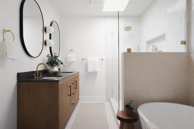 11707 Barrington Way, Austin, TX 78759 - full bathroom with walk in shower, double vanity, and a soaking tub