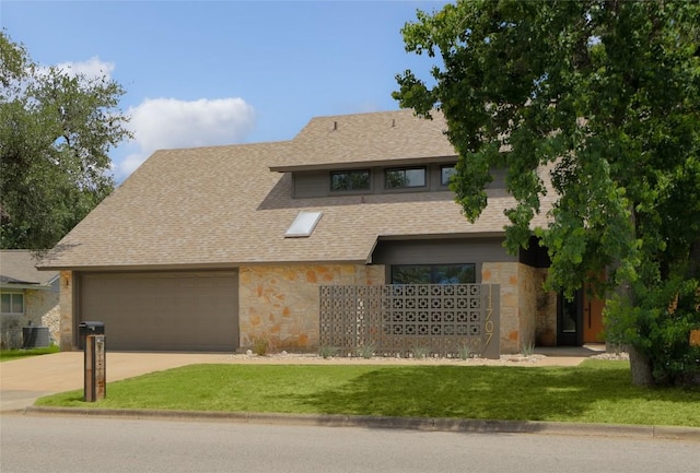 11707 Barrington Way, Austin, TX 78759 - view of front of home featuring stone siding, a garage, a front yard, and concrete driveway