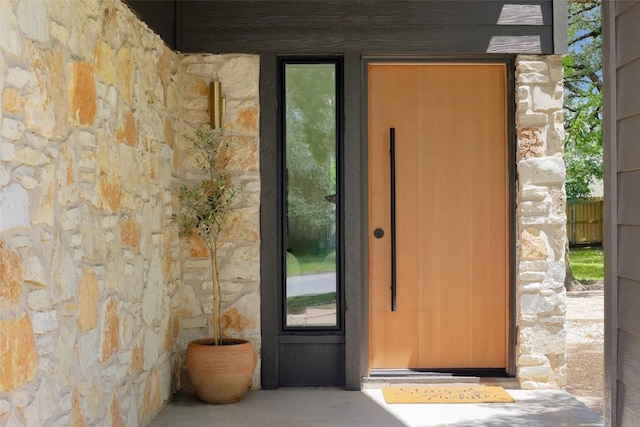 11707 Barrington Way, Austin, TX 78759 - doorway to property with stone siding