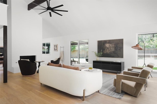 11707 Barrington Way, Austin, TX 78759 - living room with high vaulted ceiling, wood finished floors, and a ceiling fan