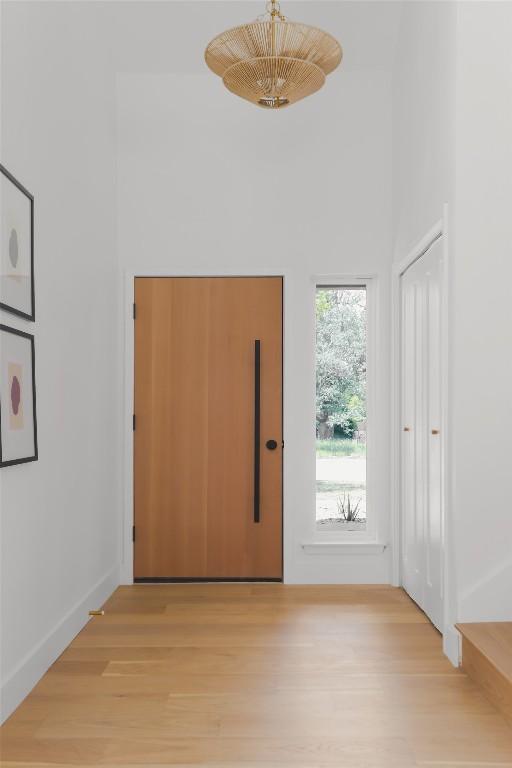 11707 Barrington Way, Austin, TX 78759 - foyer with light wood-type flooring and a towering ceiling