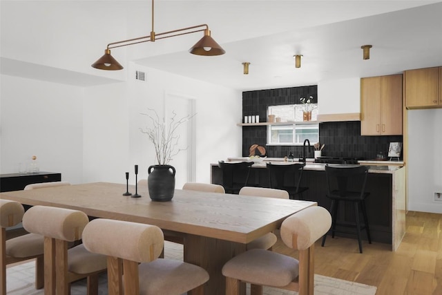 11707 Barrington Way, Austin, TX 78759 - dining space featuring light wood-style floors