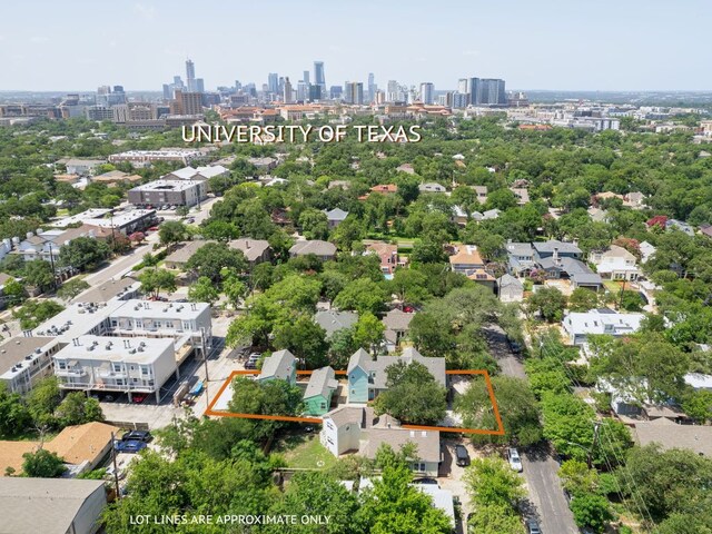3405 Cedar St, Austin, TX 78705 - aerial view of property and surrounding area with property parcel outlined and city skyline
