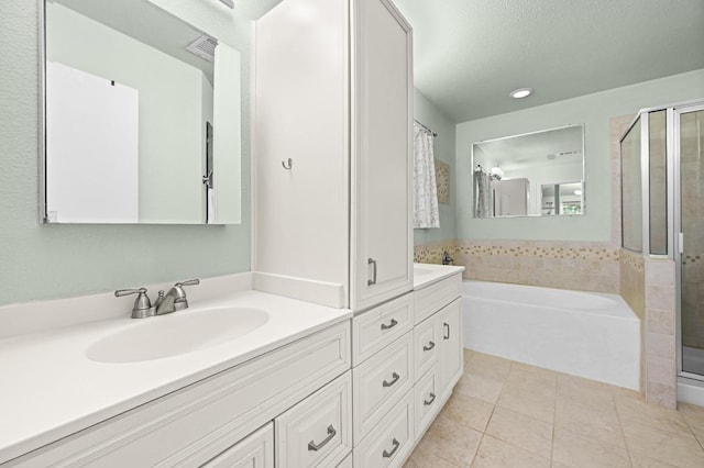 1831 Greening Way, Leander, TX 78641 - bathroom featuring double vanity, a stall shower, a bath, tile patterned floors, and recessed lighting