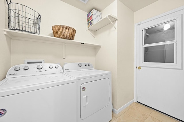 1831 Greening Way, Leander, TX 78641 - laundry room with separate washer and dryer and light tile patterned floors