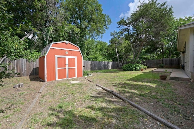 1831 Greening Way, Leander, TX 78641 - fenced backyard featuring a storage unit