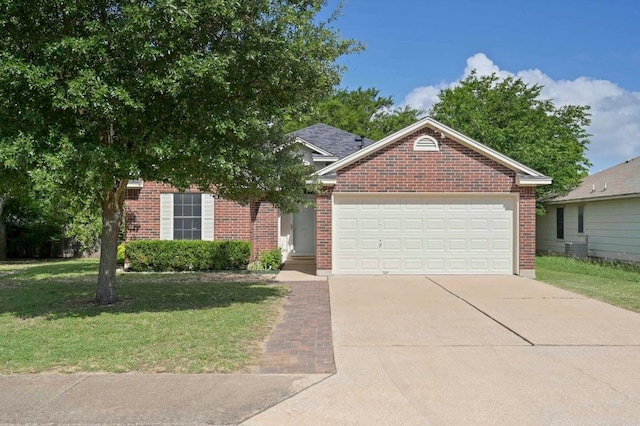 1831 Greening Way, Leander, TX 78641 - view of front of property featuring a front yard, brick siding, a garage, and concrete driveway