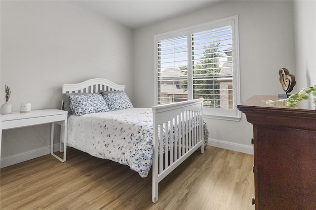 11400 W Parmer Ln Unit 4, Cedar Park, TX 78613 - bedroom featuring light wood finished floors and multiple windows