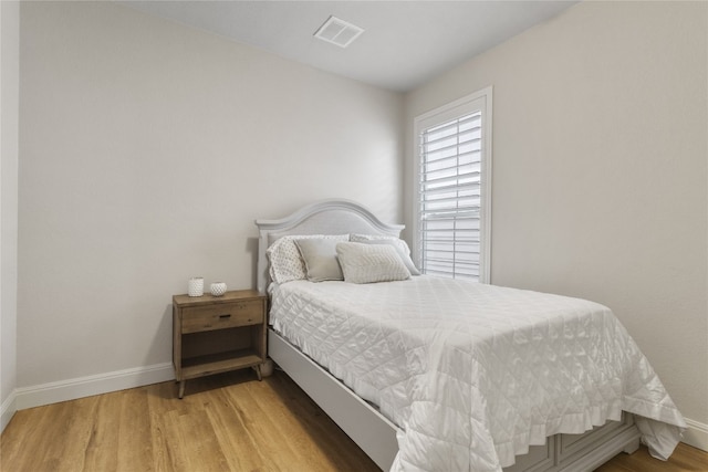 11400 W Parmer Ln Unit 4, Cedar Park, TX 78613 - bedroom featuring baseboards and light wood-style flooring
