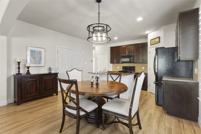 11400 W Parmer Ln Unit 4, Cedar Park, TX 78613 - dining space featuring light wood-style floors, recessed lighting, and arched walkways