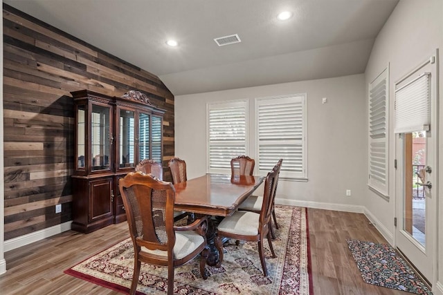 413 Fair Oaks Dr, Georgetown, TX 78628 - dining room with vaulted ceiling, healthy amount of natural light, wooden walls, light wood finished floors, and recessed lighting