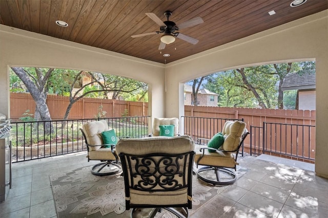 413 Fair Oaks Dr, Georgetown, TX 78628 - fenced backyard with ceiling fan and a patio area