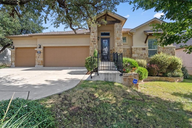 413 Fair Oaks Dr, Georgetown, TX 78628 - view of front of house with stone siding, a garage, concrete driveway, stucco siding, and a front yard
