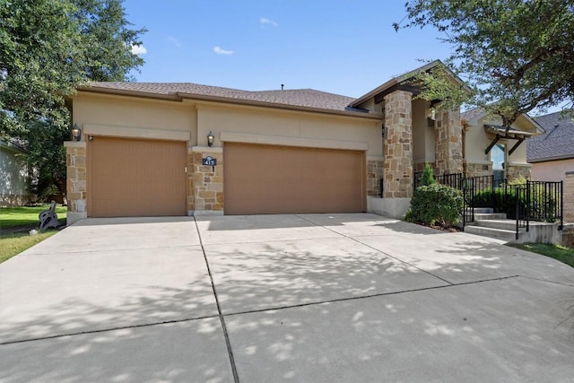413 Fair Oaks Dr, Georgetown, TX 78628 - view of front facade featuring stone siding, an attached garage, concrete driveway, and stucco siding