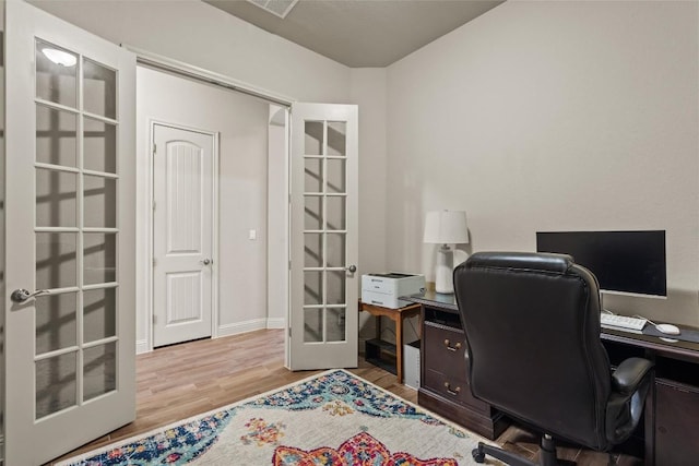 413 Fair Oaks Dr, Georgetown, TX 78628 - office area with french doors and wood finished floors