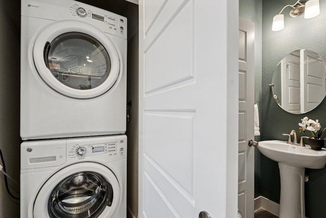 7503 Sugar Magnolia St, Austin, TX 78757 - washroom with stacked washer and clothes dryer