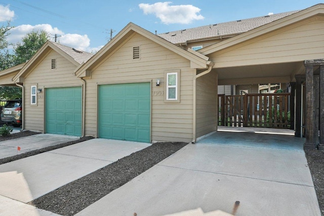 7503 Sugar Magnolia St, Austin, TX 78757 - view of front facade with a garage and driveway