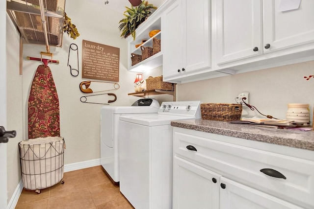 2207 Stonehaven, San Marcos, TX 78666 - laundry room with cabinet space, washer and dryer, and light tile patterned floors