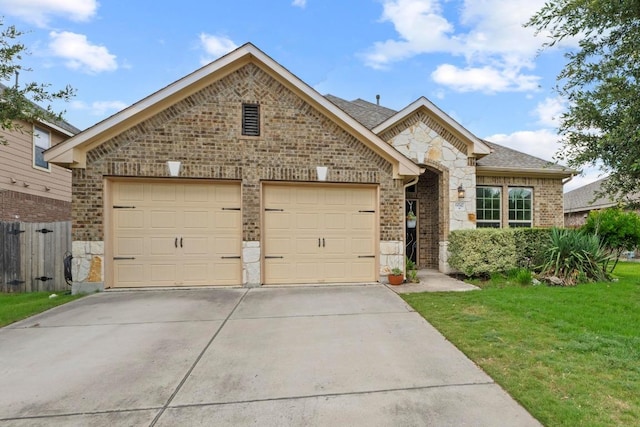 6042 Roma St, Round Rock, TX 78665 - french country style house with stone siding, brick siding, concrete driveway, a garage, and a shingled roof