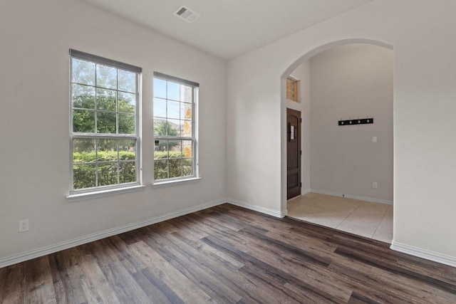 6042 Roma St, Round Rock, TX 78665 - unfurnished room with arched walkways and wood finished floors
