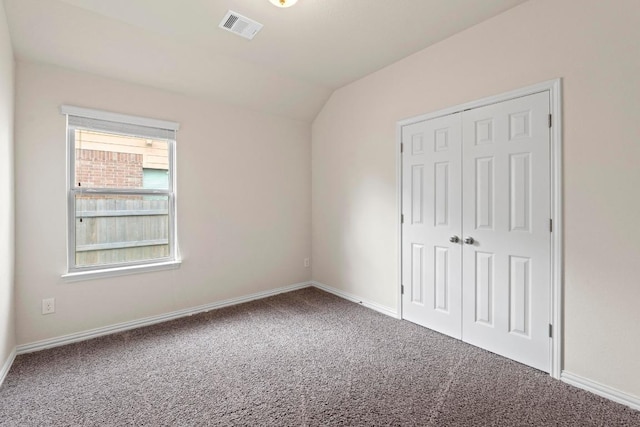 6042 Roma St, Round Rock, TX 78665 - unfurnished bedroom with carpet flooring, lofted ceiling, and a closet