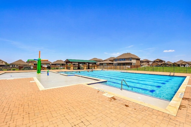 6042 Roma St, Round Rock, TX 78665 - community pool with a residential view and a patio