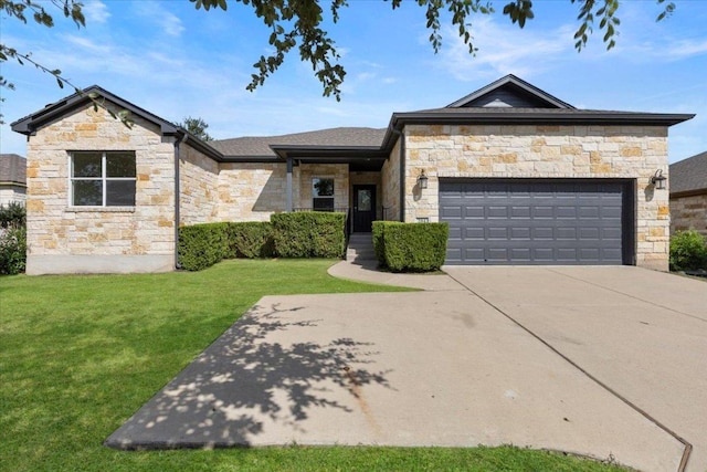 204 S Meadowlark St, Lakeway, TX 78734 - view of front facade featuring stone siding, a front yard, a garage, and driveway