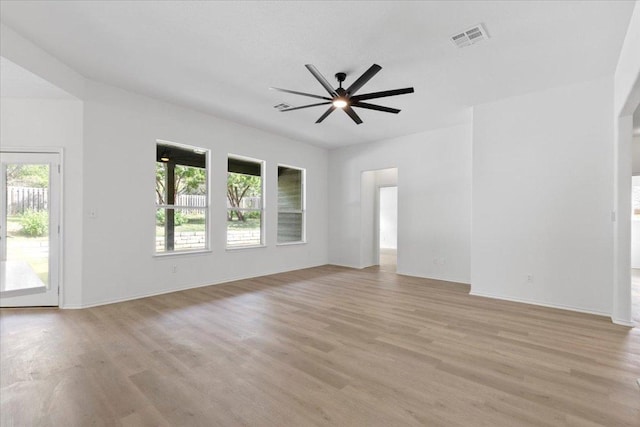 204 S Meadowlark St, Lakeway, TX 78734 - empty room featuring plenty of natural light, light wood-style floors, and a ceiling fan