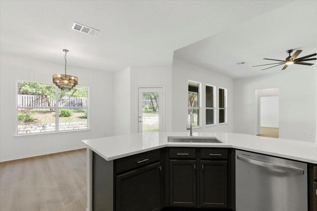 204 S Meadowlark St, Lakeway, TX 78734 - kitchen with dishwasher, light countertops, light wood-style flooring, pendant lighting, and a ceiling fan