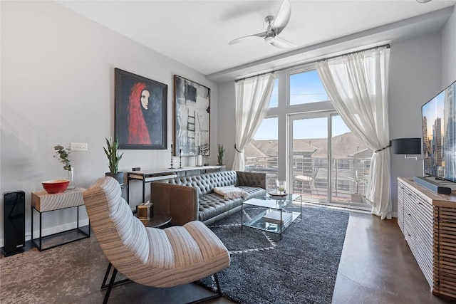 2124 E 6th St Unit 319, Austin, TX 78702 - living room with concrete floors and ceiling fan