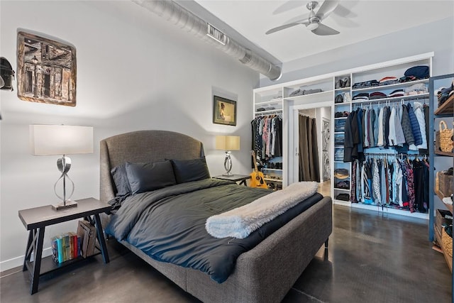 2124 E 6th St Unit 319, Austin, TX 78702 - bedroom featuring concrete flooring and a ceiling fan