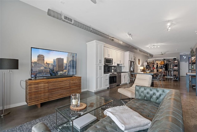 2124 E 6th St Unit 319, Austin, TX 78702 - living room featuring baseboards