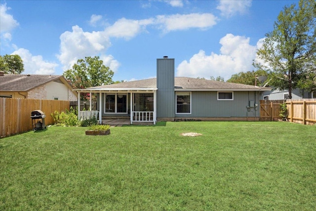 4910 Wing Rd, Austin, TX 78749 - rear view of property featuring a fenced backyard, a sunroom, and a chimney