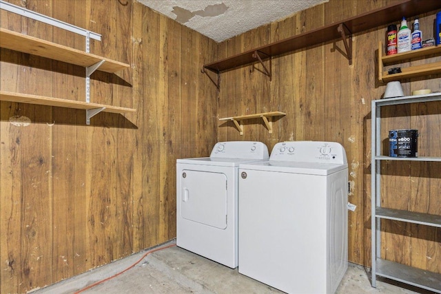 4910 Wing Rd, Austin, TX 78749 - washroom featuring washer and dryer and wood walls