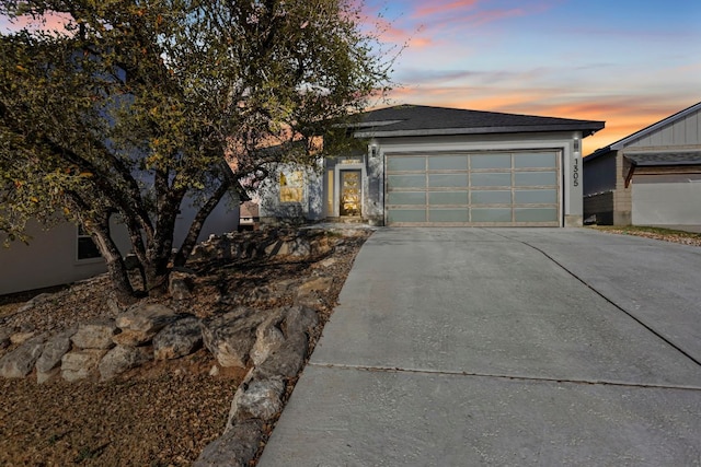 1305 Laurel Cv, Marble Falls, TX 78654 - view of front of home featuring driveway and an attached garage