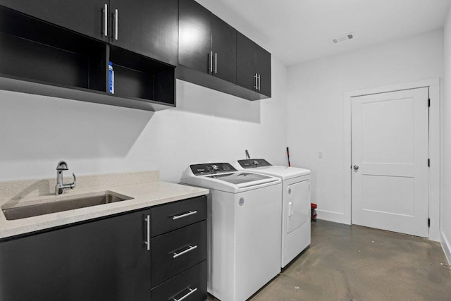 1305 Laurel Cv, Marble Falls, TX 78654 - laundry room featuring separate washer and dryer and cabinet space