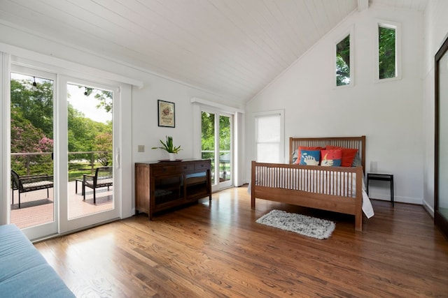 3102 Hemphill Park, Austin, TX 78705 - bedroom featuring multiple windows, access to exterior, wood finished floors, and high vaulted ceiling