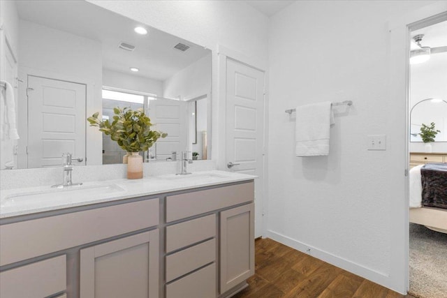 13716 Clerk St, Pflugerville, TX 78660 - ensuite bathroom with wood finished floors and double vanity
