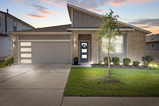 13716 Clerk St, Pflugerville, TX 78660 - mid-century home with board and batten siding, brick siding, concrete driveway, an attached garage, and a front lawn